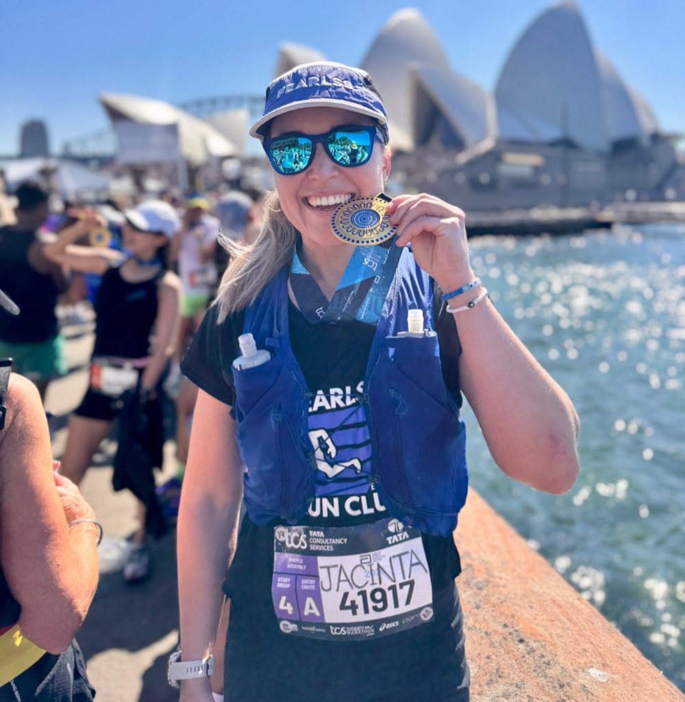 Coach Jacinta Robinson with her medal at the Sydney Marathon