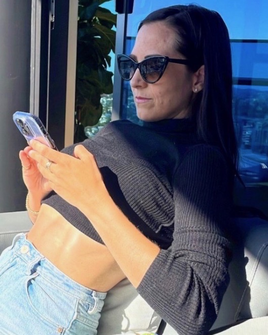 Choosing a FEARLSS plan on her phone