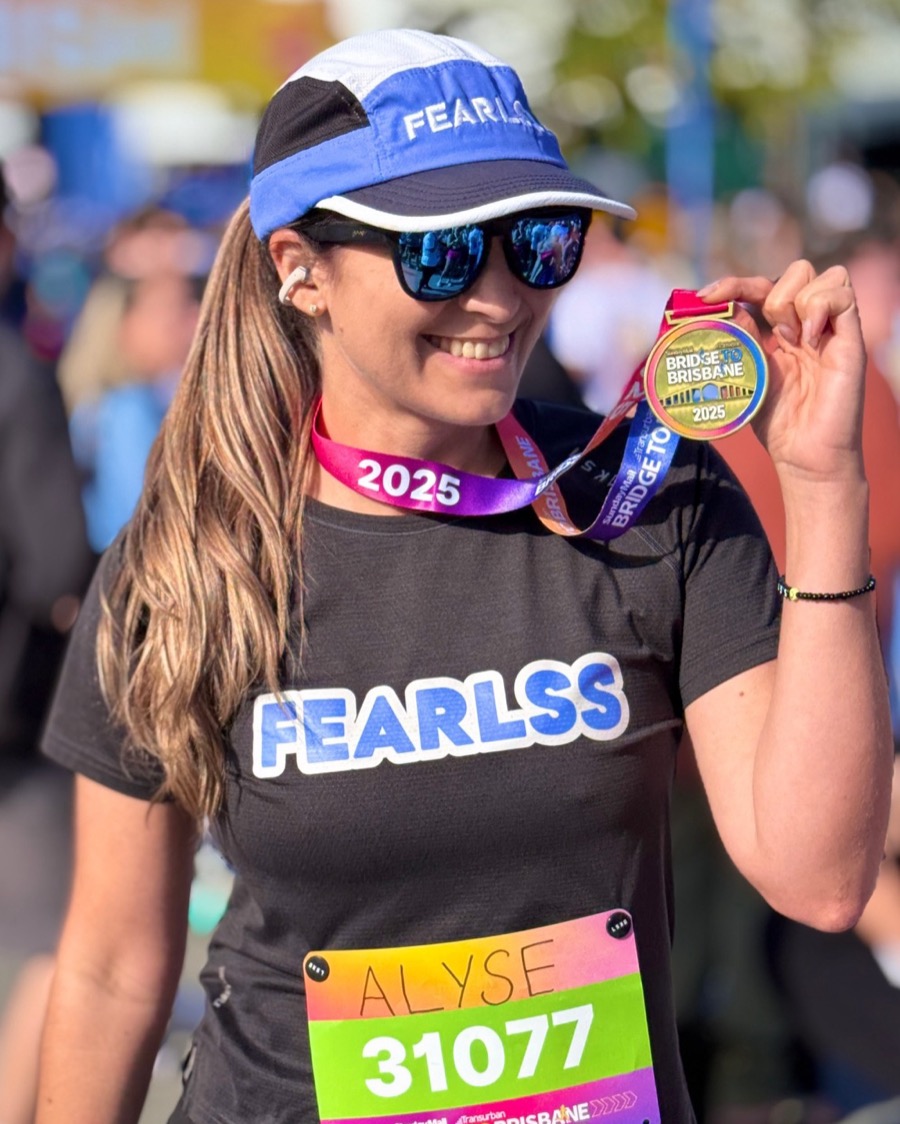 Alyse with her Bridge to Brisbane medal